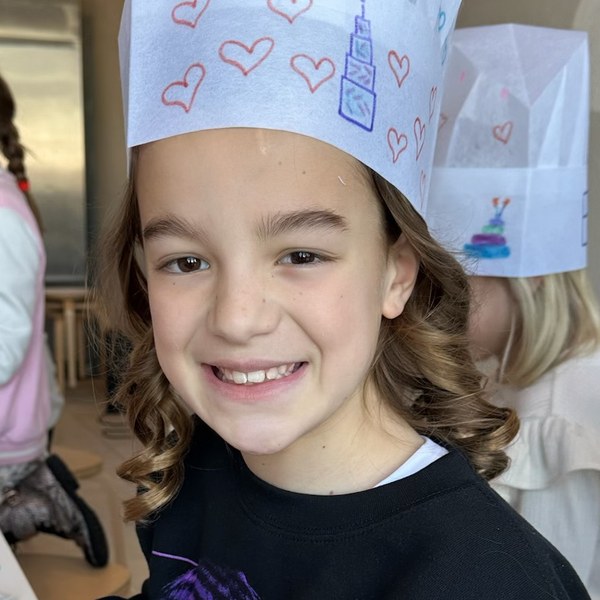 Celeste in her chef hat